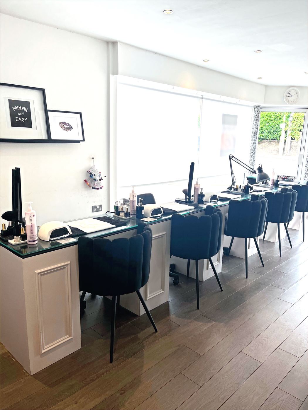 Manicure stations along the salon window